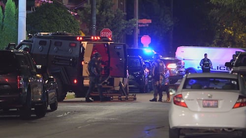 ‘We will not stop until you’re in custody’: Police raid home as hunt continues for Hamilton shooting suspect