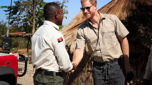 Prince Harry retraces Diana’s footsteps by walking through a land mine field in Angola for charity