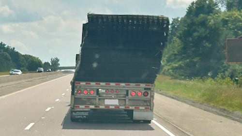 Driver charged after load of fencing comes loose on Hwy. 401